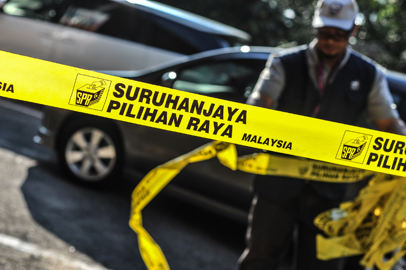 The Election Commission (EC) logo is seen on yellow tape around the SK Yong Peng voting centre in Yong Peng May 9, 2018. u00e2u20acu201d Picture by Shafwan Zaidon
