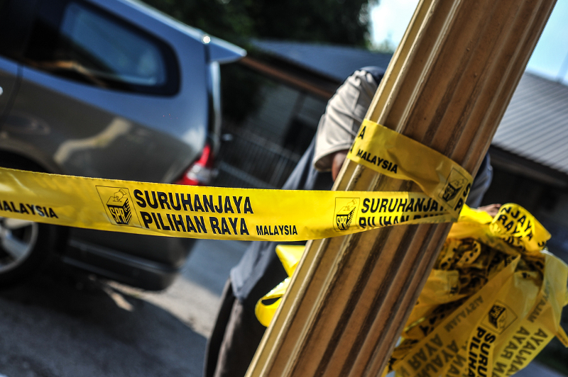 The Election Commission (EC) logo is seen on yellow tape around the SK Yong Peng voting centre in Yong Peng May 9, 2018. u00e2u20acu201d Picture by Shafwan Zaidon