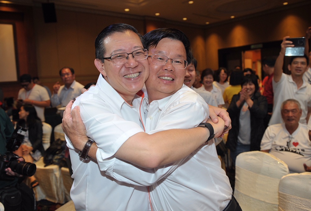 Lim Guan Eng and Chow Kon Yeow congratulate each other at the tallying centre in George Town May 9, 2018. u00e2u20acu201d Picture by KE Ooi