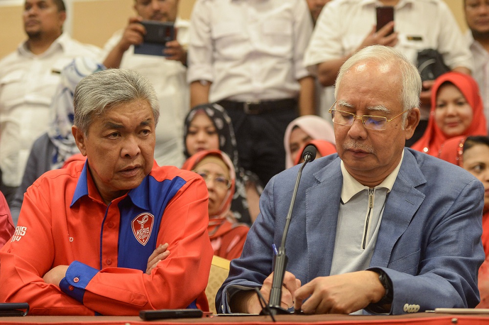 Datuk Seri Zahid Hamidi and Datuk Seri Najib Razak at a press conference announcing the latter's resignation as Umno president and BN chairman in Kuala Lumpur May 12, 2018. u00e2u20acu201d Picture by Mukhriz Hazim