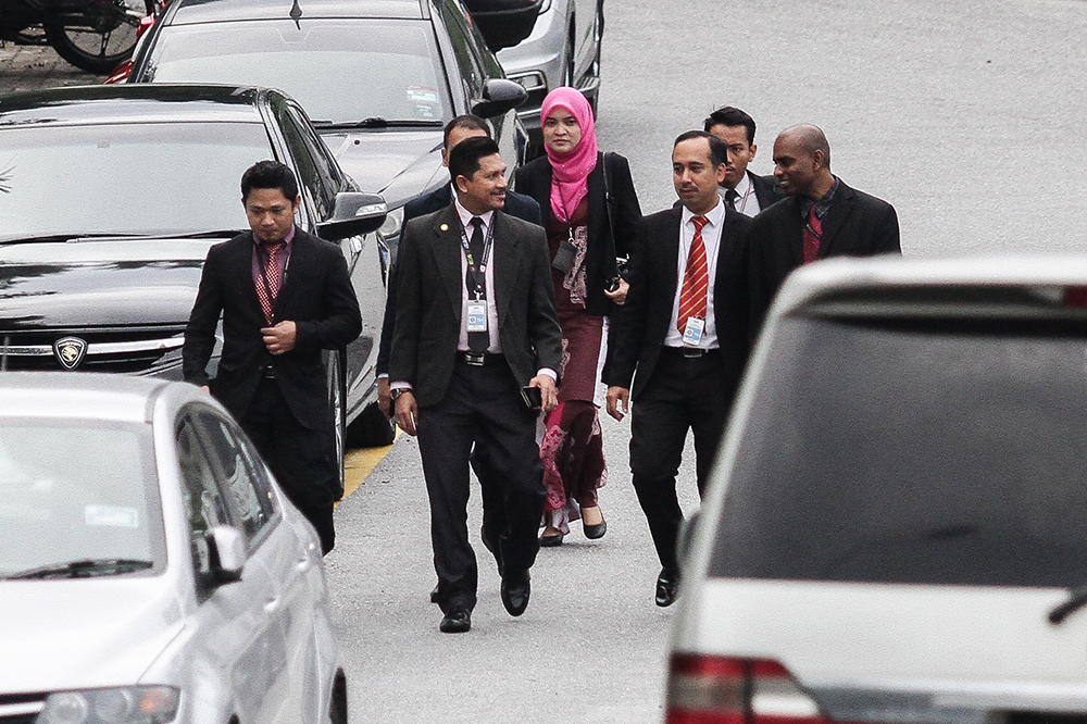 MACC officers leave the residence of Datuk Seri Najib Razak in Taman Duta, Kuala Lumpur May 18, 2018. — Picture by Miera Zulyana