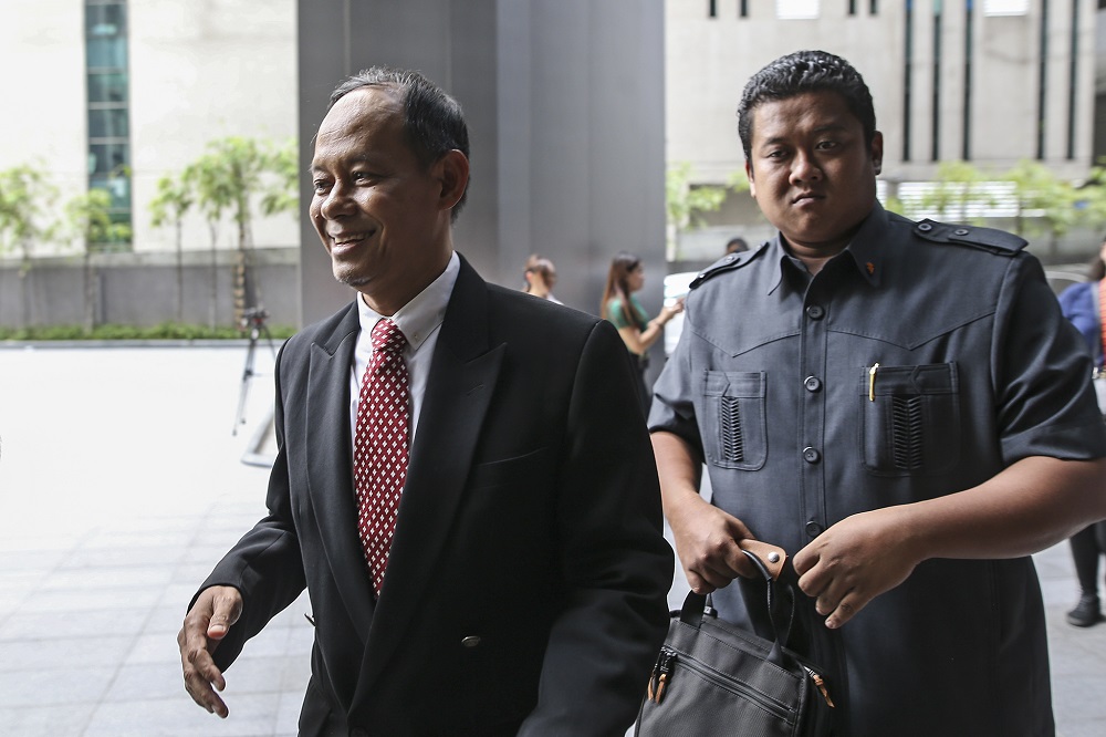 MACC chief commissioner Datuk Sri Mohd Shukri Abdull (left)  arrives at Ilham Tower in Kuala Lumpur May 21, 2018. u00e2u20acu201d Picture by Azneal Ishak