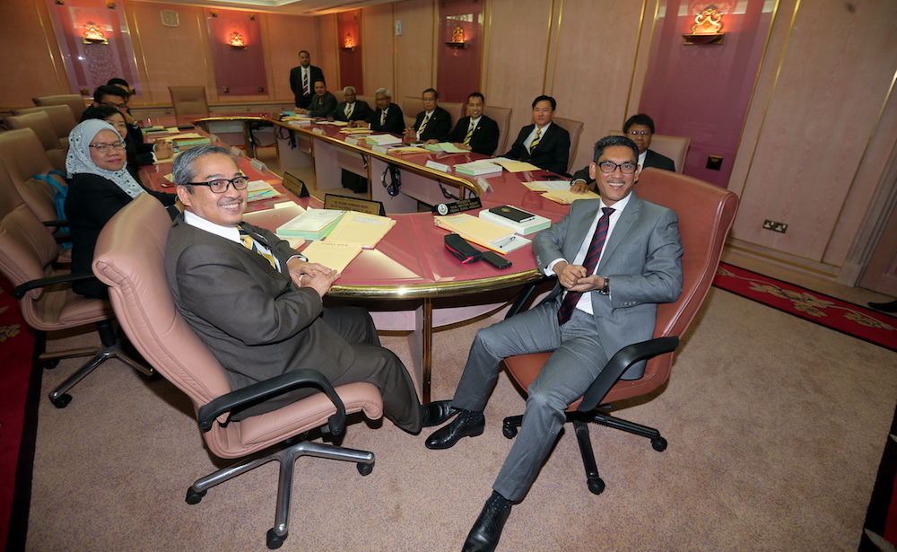 Mentri Besar Ahmad Faizal Azumu (right) together with State Finance Officer Datuk Ghazali Jalal (left) and state officials attend their first exco meeting at the State Secretariat Building in Ipoh May 23, 2018. u00e2u20acu201d Picture by Farhan Najib