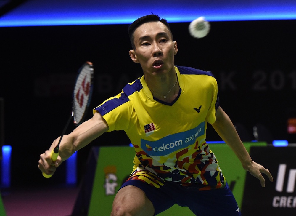 Lee Chong Wei of Malaysia hits a return against Vladimir Malkov of Russia during their men's singles match at the Thomas and Uber Cup badminton tournament in Bangkok May 21, 2018. u00e2u20acu201d AFP pic