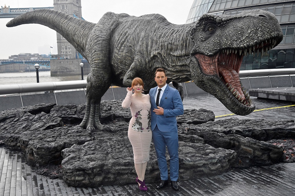 Cast members Chris Pratt and Bryce Dallas Howard pose in front of a model dinosaur during a photocall to promote the forthcoming film u00e2u20acu02dcJurassic World: Fallen Kingdomu00e2u20acu2122 in London May 24, 2018. u00e2u20acu201d Reuters pic