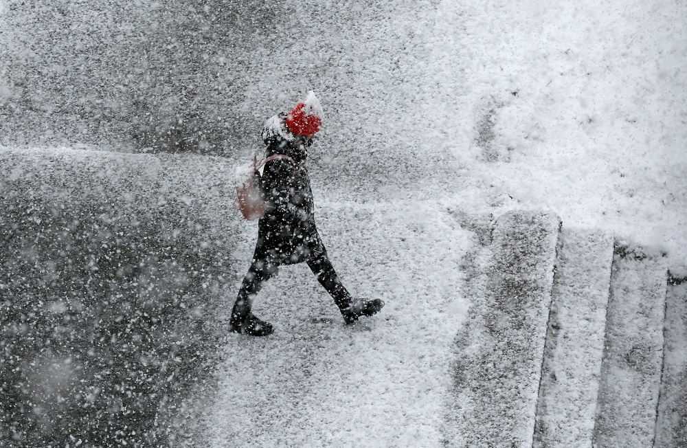A pedestrian walks during a heavy snowfall in the Siberian town of Divnogorsk, Russia May 7, 2018. u00e2u20acu201d Reuters pic