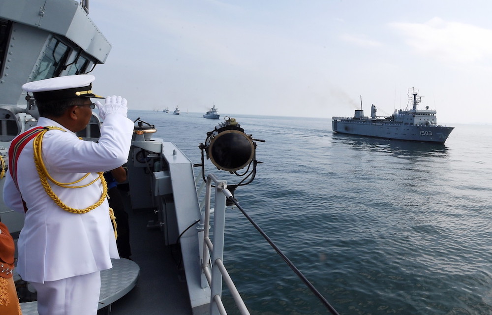 Western Armada Commander Vice Admiral Datuk Seri Mohamad Roslan Mohamad Ramli salutes Royal Malaysian Navy ship KD Lekiu at RMNu00e2u20acu2122s Lumut Naval Base May 25, 2018. u00e2u20acu201d Bernama pic