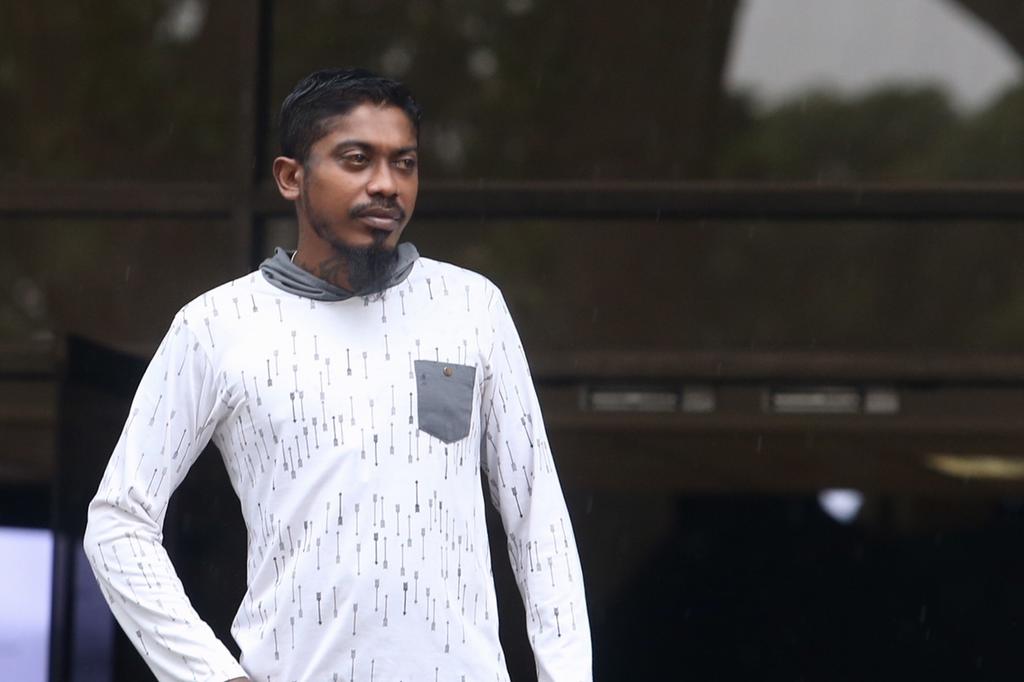 Kunasegaran Arumugam, who is one of four men charged for involvement in gang-related activities, seen leaving the State Courts. u00e2u20acu201d TODAY pic