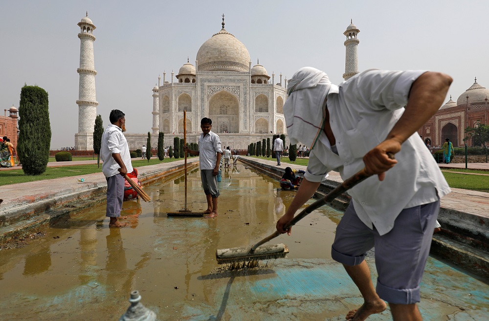 Labourers clean the fountain in the historic Taj Mahal premises in Agra, India May 19, 2018. u00e2u20acu201d Reuters pic