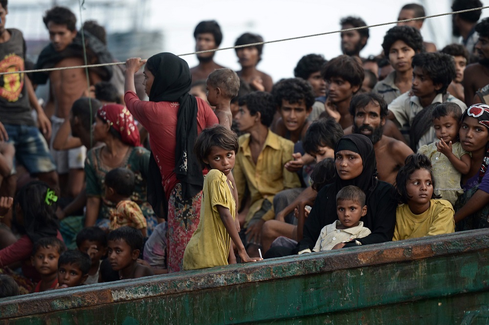 In this file photo taken on May 14, 2015 Rohingya migrants stand and sit on a boat drifting in Thai waters off the southern island of Koh Lipe in the Andaman sea. — AFP pic