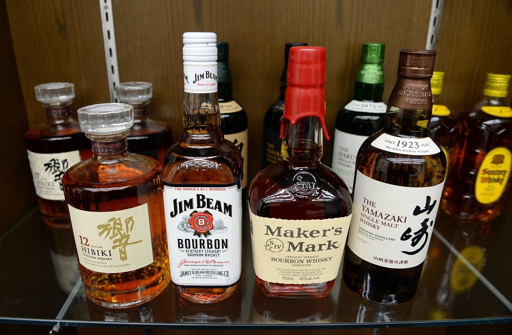 Japanese drink giant Suntory's whisky Yamazaki (right), Hibiki (left) and US beverage giant Beam's bourbon whisky Jim Beam (second from left), Maker's Mark. u00e2u20acu201d AFP pic