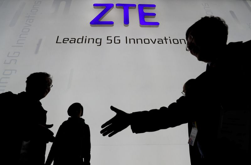 Visitors pass in front of the Chinese telecoms equipment group ZTE Corp booth at the Mobile World Congress in Barcelona, Spain, February 26, 2018. u00e2u20acu201dReuters pic