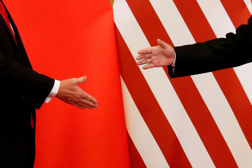 US President Donald Trump and China's President Xi Jinping shake hands after making joint statements at the Great Hall of the People in Beijing November 9, 2017. u00e2u20acu201d Reuters pic