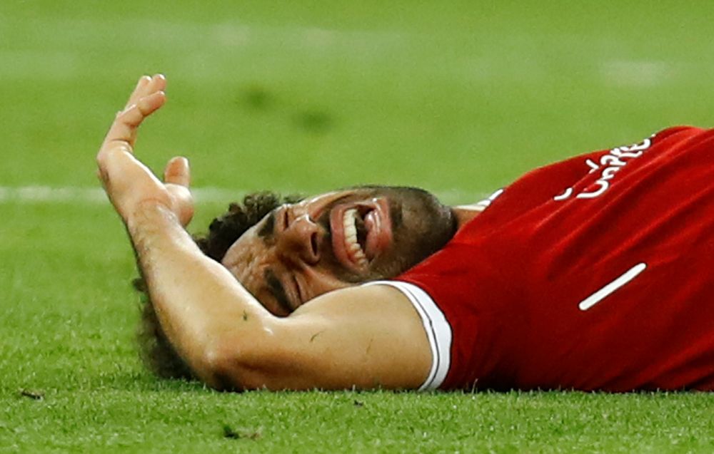Liverpoolu00e2u20acu2122s Mohamed Salah reacts after sustaining an injury during their Champions League Final match against Real Madrid at NSC Olympic Stadium, Kiev, Ukraine, May 26, 2018. u00e2u20acu201d Reuters pic
