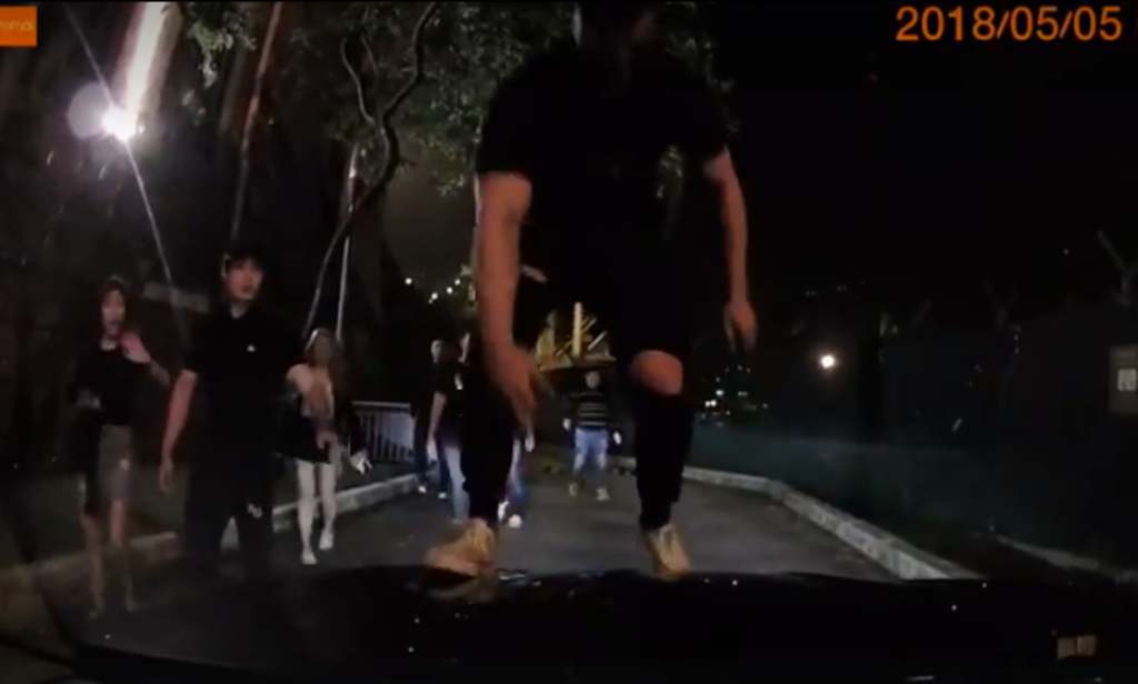 A screengrab from dashcam footage showing Chee Chu Siong allegedly jumping on the hood of a private-hire car. u00e2u20acu201d Screengrab from Facebook