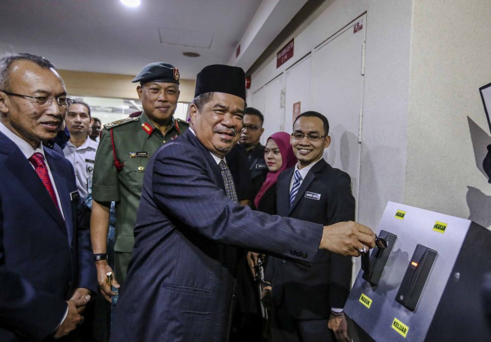 Defence Minister Mohamad Sabu clocks in to officially begin his first day at work in Mindef, Kuala Lumpur. u00e2u20acu2022 Picture by FIrdaus Latif