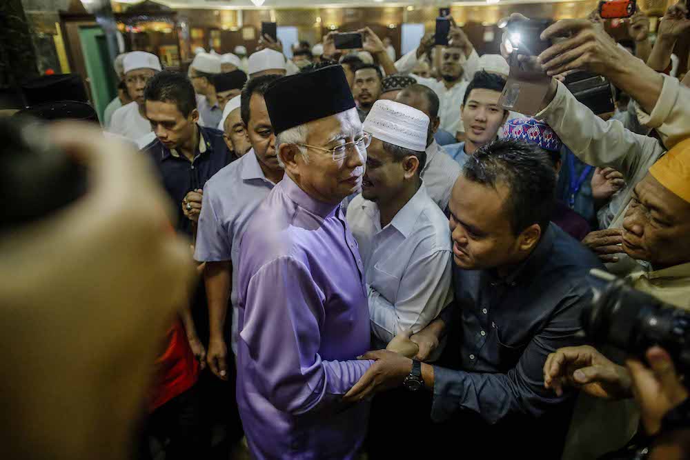 Datuk Seri Najib Razak leaves PWTC in Kuala Lumpur May 18, 2018, after performing Friday prayers. u00e2u20acu201d Picture by Firdaus Latif