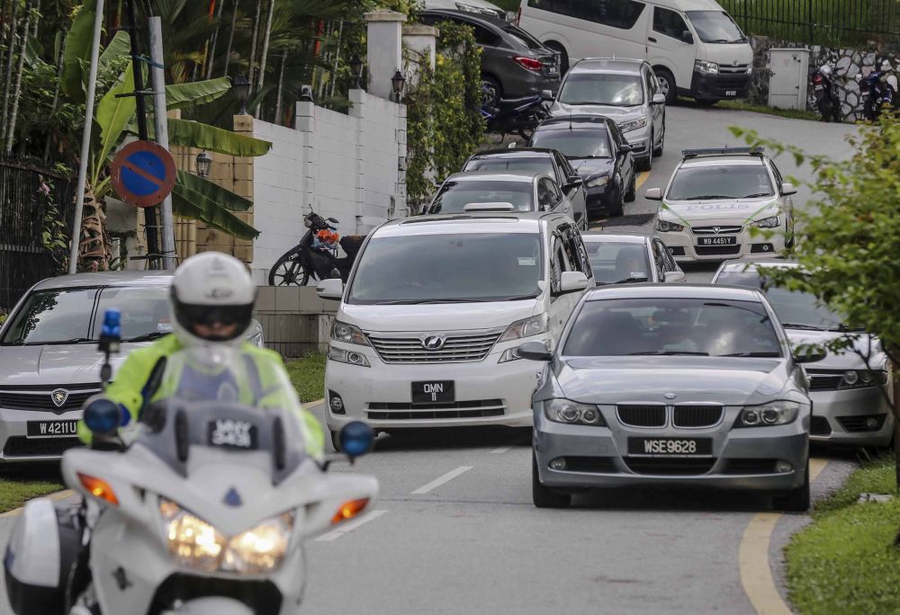 nA white Toyota Vellfire believed to be ferrying Datuk Seri Najib Razak is seen leaving his residence in Kuala Lumpur May 18, 2018. u00e2u20acu201d Picture by Firdaus Latifn