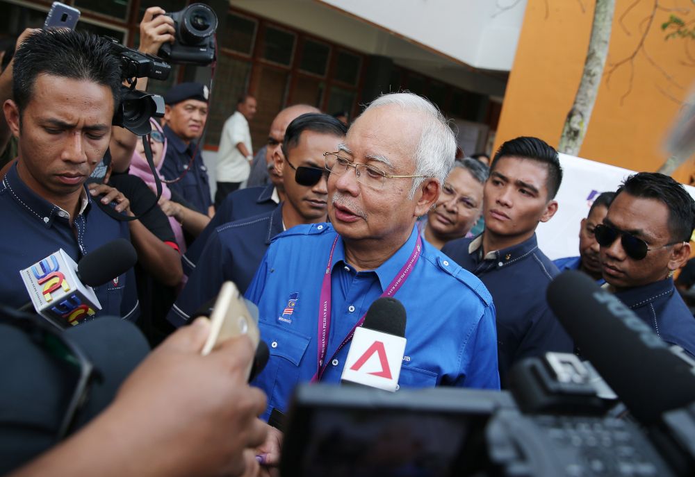 Datuk Seri Najib Razak speaks to the media after casting his vote at a polling station in Pekan May 9, 2018. u00e2u20acu2022 Reuters pic