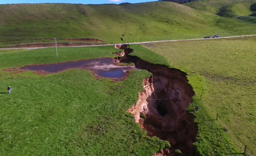 This frame grab from TVNZ video footage taken on May 2, 2018 and released to AFP on May 7 shows a sinkhole that appeared on a dairy farm near Rotorua on New Zealand's North Island. u00e2u20acu201d AFP pic 