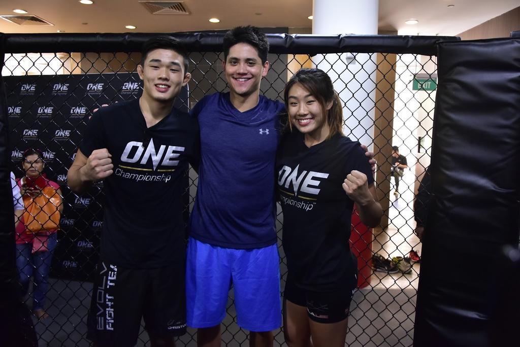 National swimmer Joseph Schooling (centre) with One Championship athletes Christian Lee and Angela Lee. u00e2u20acu201d Picture courtesy of ONE Championship