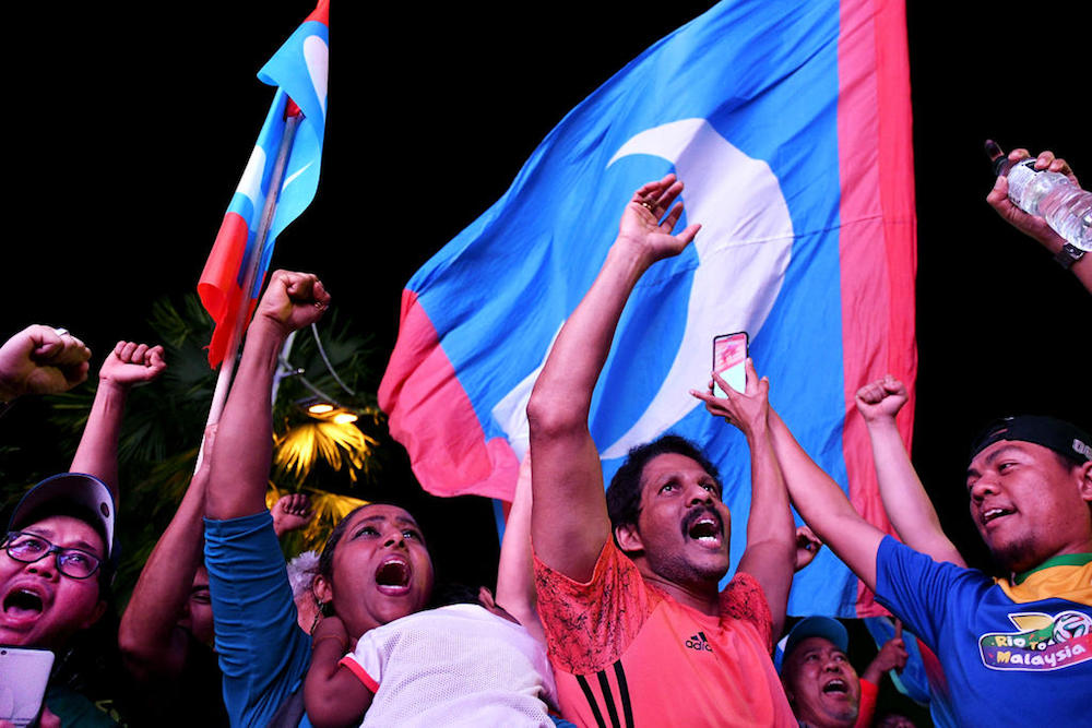 Malaysians celebrating Pakatan Harapan's historic electoral victory that was underpinned by a large swing in the Malay votes. u00e2u20acu201d Reuters pic