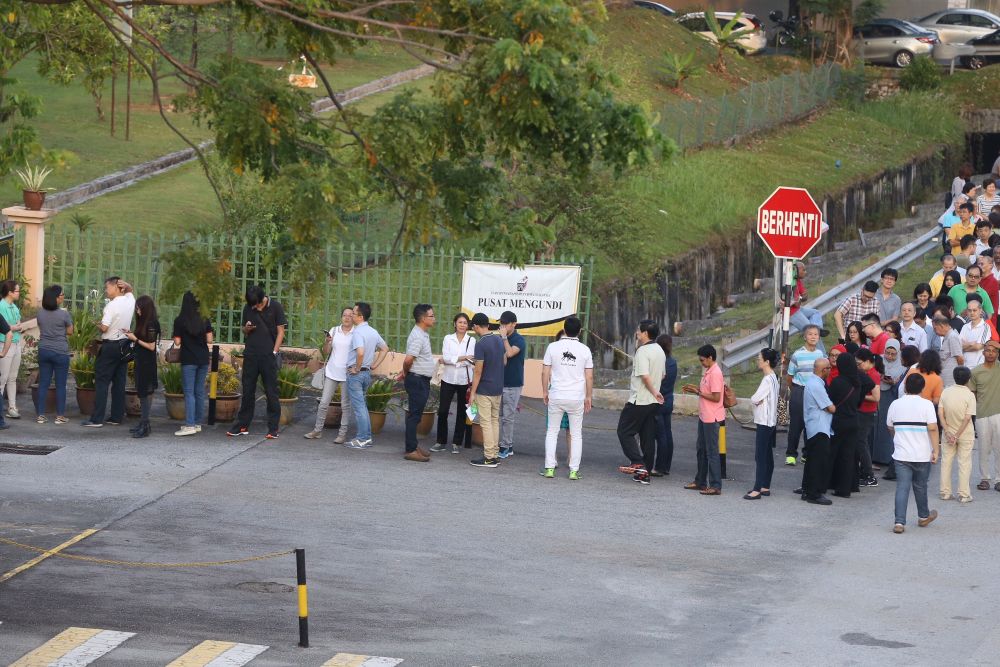 Voters queue up outside a polling centre in Subang Jaya May 9, 2018. ― Picture by Zuraneeza Zulkifli