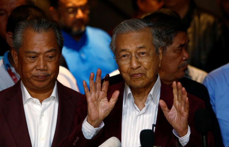 Tan Sri Muhyiddin Yassin and Tun Dr Mahathir Mohamad attend a meeting with supporters after the general election in Petaling Jaya May 9, 2018. u00e2u20acu201d Reuters pic