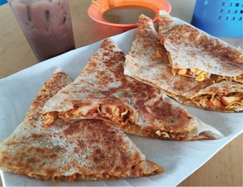 Customise your ‘Roti Maggi’ by slapping some tandoori chicken meat inside the ‘roti canai.’  — Malay Mail pic