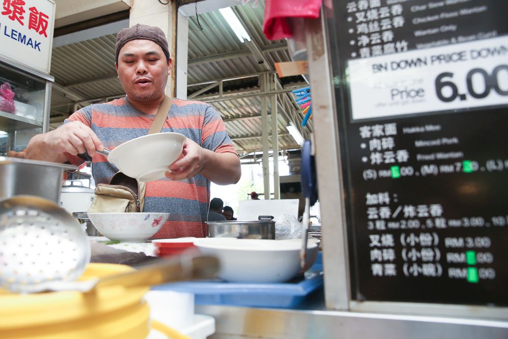 The owner of Sam Kee is charging customers a flat rate of RM6 for a bowl of wanton noodles, regardless of size, over the next 100 days following Pakatanu00e2u20acu2122s win and the abolishment of GST. u00e2u20acu201d Picture by Choo Choy May