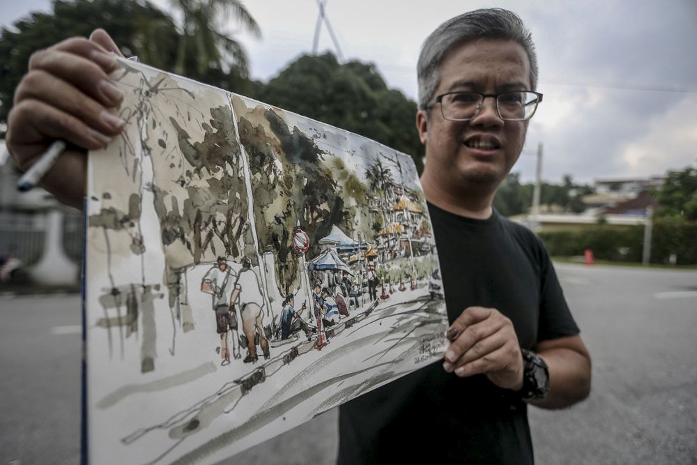 Tan poses with his watercolour. — Picture by Hari Anggara