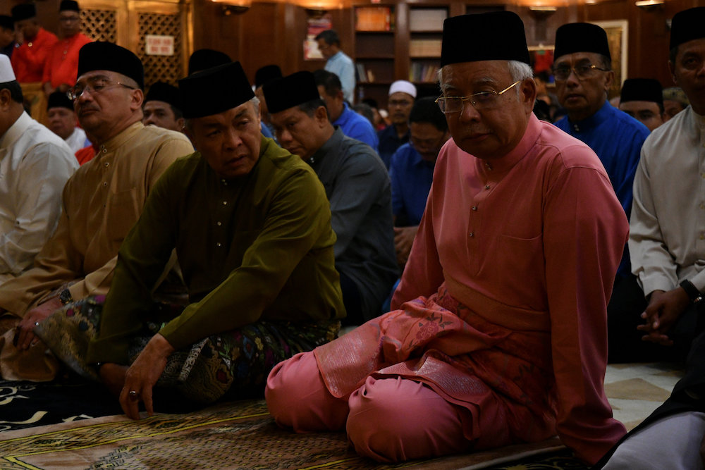 Datuk Seri Ahmad Zahid Hamidi and Datuk Seri Najib Razak attend special prayers for Umnou00e2u20acu2122s 72nd anniversary in Kuala Lumpur May 11, 2018. u00e2u20acu201d Reuters pic