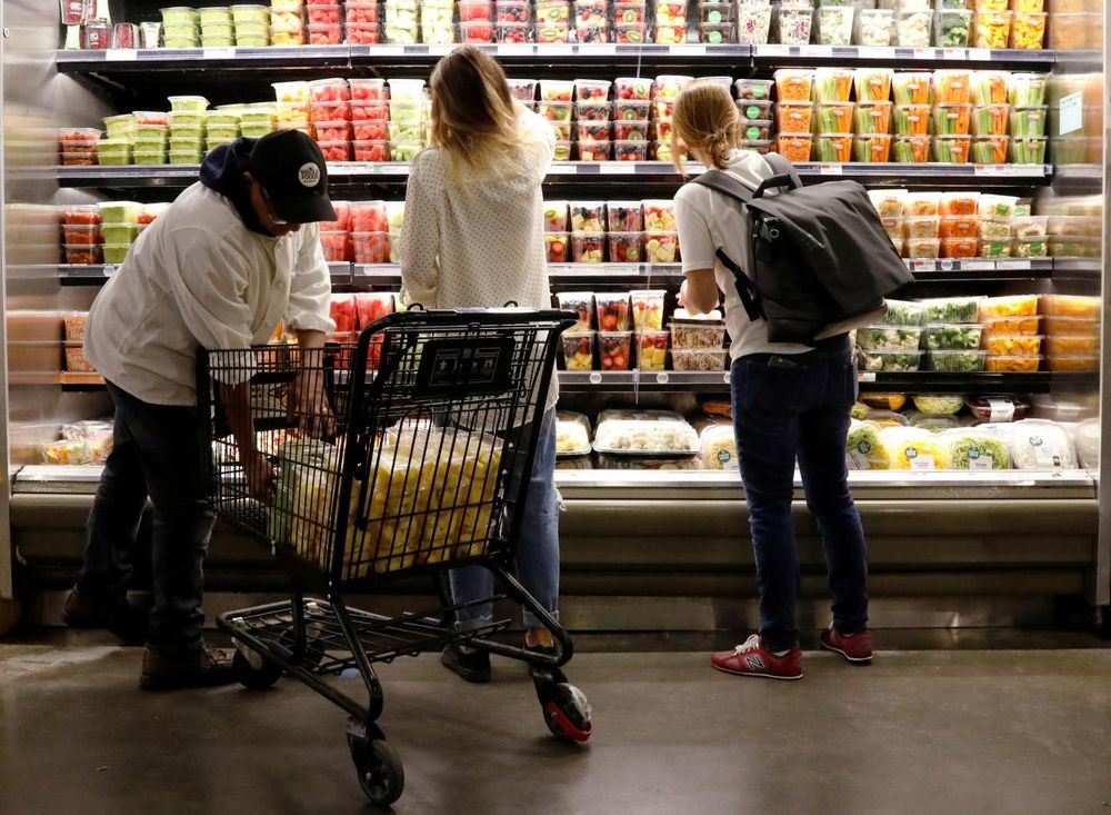 Customers shop at a Whole Foods store in New York City, August 28, 2017. u00e2u20acu201d Reuters pic