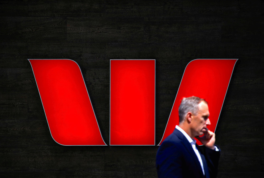 A man talks on his mobile phone in front of a Westpac Bank logo in central Sydney, Australia, October 2, 2015. u00e2u20acu201d Reuters pic