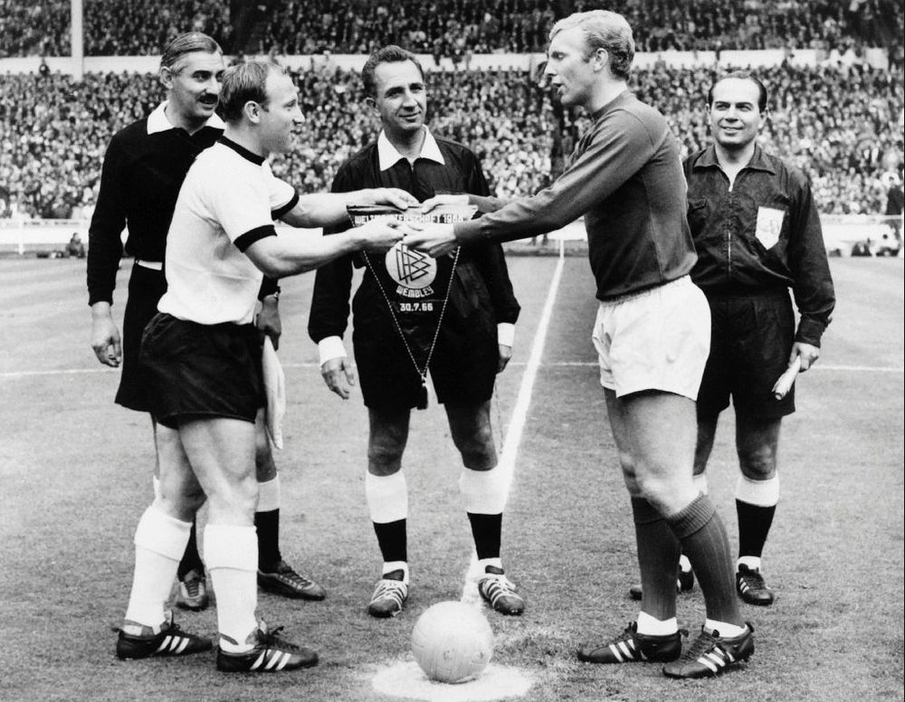 West Germany captain Uwe Seeler (left) and Englandu00e2u20acu2122s Bobby Moore exchange pennants before the start of the World Cup final at Wembley on July 30, 1966. u00e2u20acu201d AFP pic