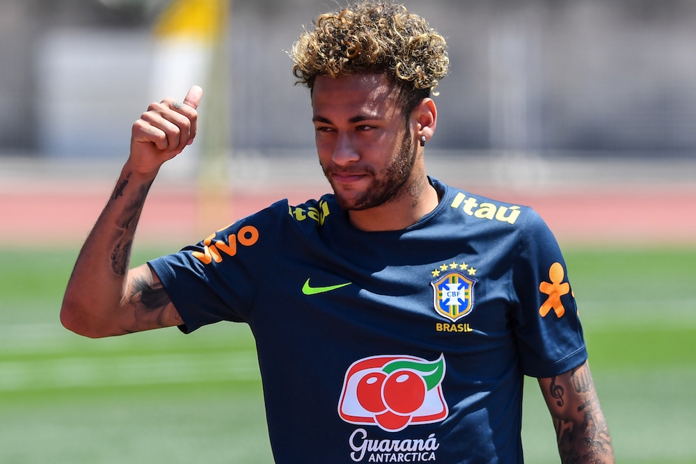 Brazilu00e2u20acu2122s striker Neymar greets supporters during a training session at Sochi Municipal Stadium in Sochi June 12, 2018, ahead of the Russia 2018 World Cup football tournament. u00e2u20acu201d AFP pic