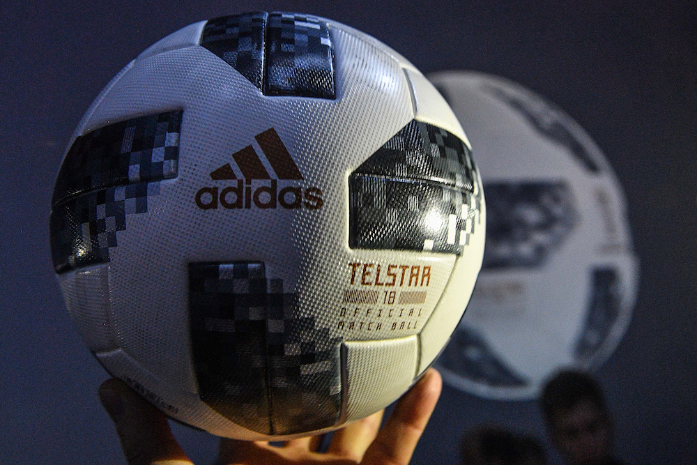 A participant holds the official match ball for the 2018 World Cup football tournament, named u00e2u20acu02dcTelstar 18.u00e2u20acu2122 u00e2u20acu201d AFP pic