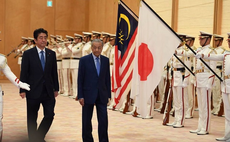 Dr Mahathir with his Japanese counterpart Abe in Tokyo last month. The writer believes that today’s changed geopolitical landscape requires the infusion of a democratic element. — Bernama pic