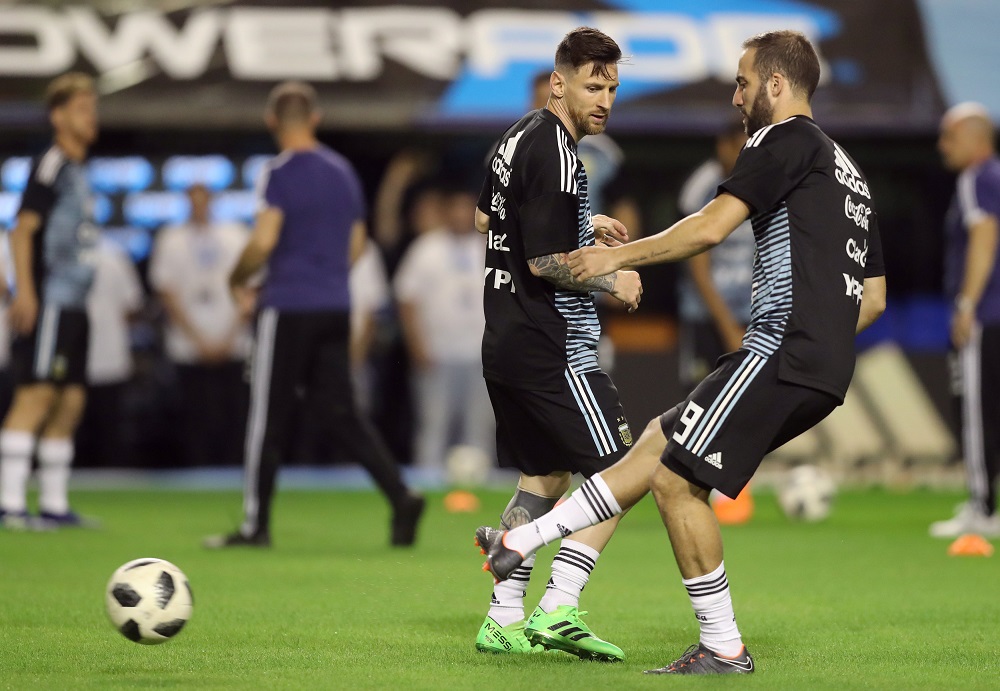 Argentinau00e2u20acu2122s Lionel Messi and Gonzalo Higuain warm up before the match against Haiti in Buenos Aires May 29, 2018. u00e2u20acu201d Reuters pic