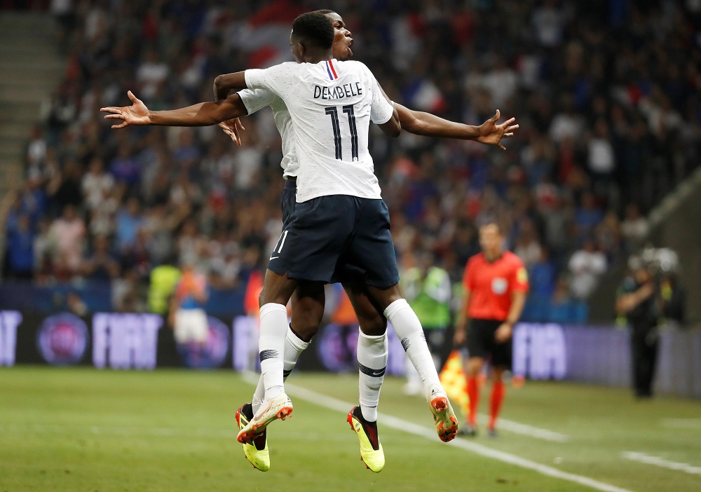 Franceu00e2u20acu2122s Ousmane Dembele celebrates scoring their third goal with Paul Pogba in Nice June 1, 2018. u00e2u20acu201d Reuters pic