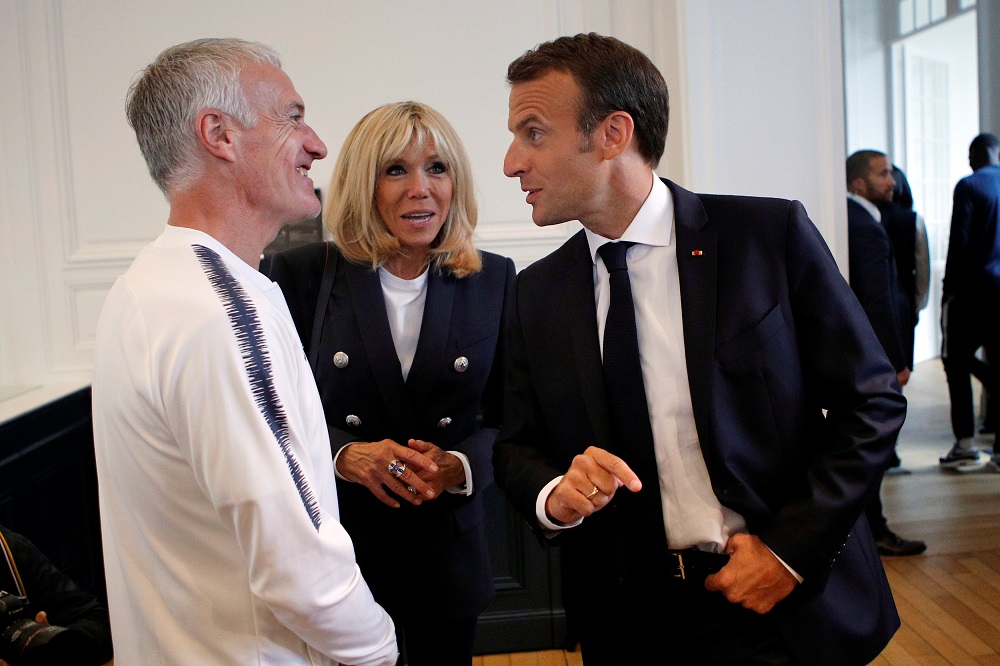 Emmanuel Macron (right) speaks to the French national football team head coach Didier Deschamps as his wife, Brigitte Macron looks on during a meeting at Franceu00e2u20acu2122s training camp in Clairefontaine, near Paris June 5, 2018. u00e2u20acu201d Reuters pic