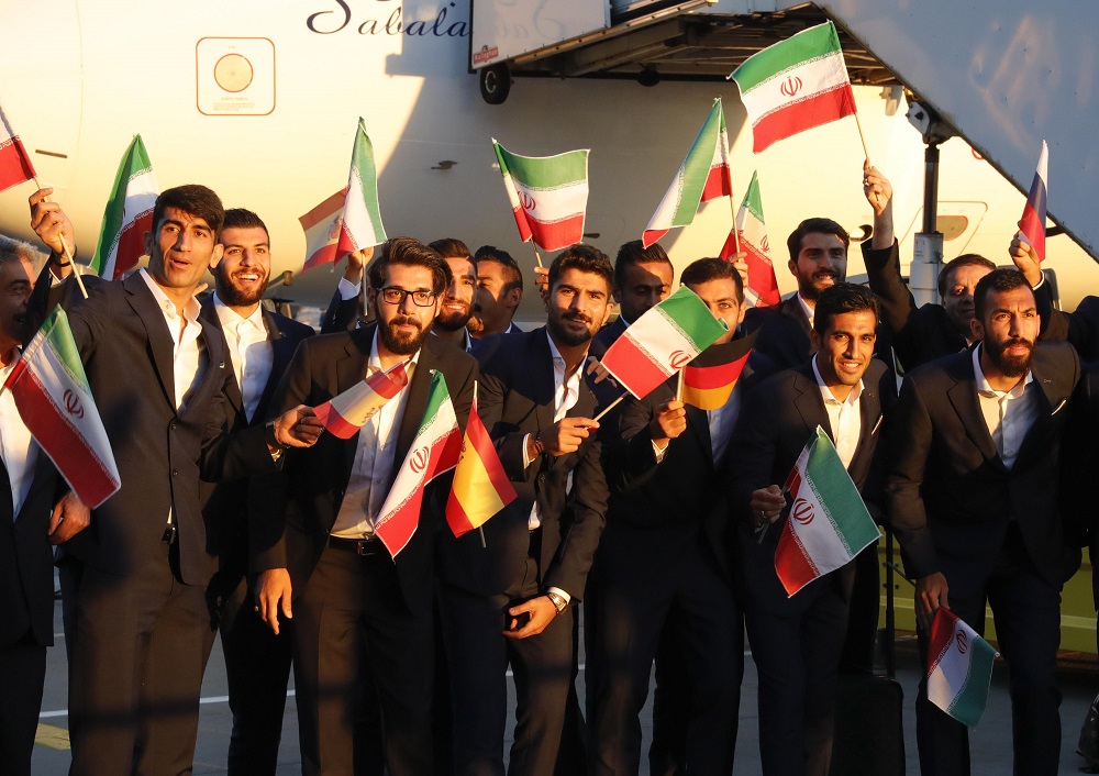 Members of the Iranian national football team, who will compete in the upcoming 2018 Fifa World Cup, hold flags during a welcoming ceremony upon their arrival at Vnukovo airport outside Moscow June 5, 2018. u00e2u20acu201d Reuters pic
