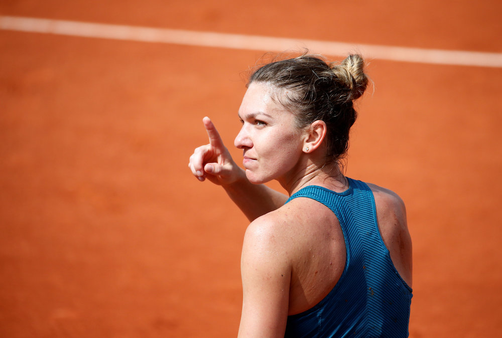 Romaniau00e2u20acu2122s Simona Halep celebrates winning her quarter-final match against Germanyu00e2u20acu2122s Angelique Kerber at the 2018 French Open in Paris June 6, 2018. u00e2u20acu201d Reuters pic