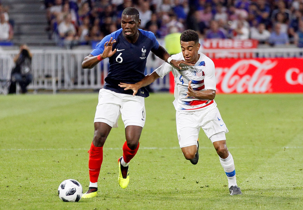 Franceu00e2u20acu2122s Paul Pogba in action with USAu00e2u20acu2122s Tyler Adams during the international friendly at Groupama Stadium in Lyon June 9, 2018. u00e2u20acu201d Reuters pic