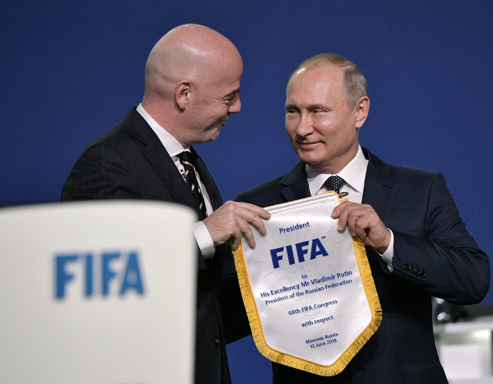Fifa President Gianni Infantino presents a memorable pennon to Russian President Vladimir Putin during the 68th Fifa Congress in Moscow June 13, 2018. u00e2u20acu201d Reuters pic