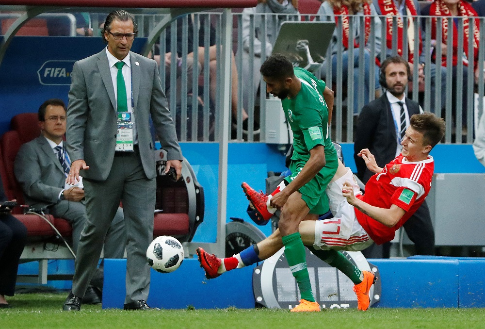 Russia's Aleksandr Golovin in action with Saudi Arabia's Salman Al-Faraj as coach Juan Antonio Pizzi looks on during the match in Moscow June 14, 2018. u00e2u20acu201d Reuters pic 