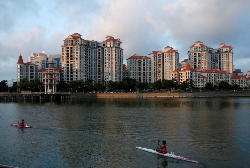 Kayakers pass private residential condominiums at Tanjong Rhu in Singapore August 18, 2016. u00e2u20acu201d Reuters pic