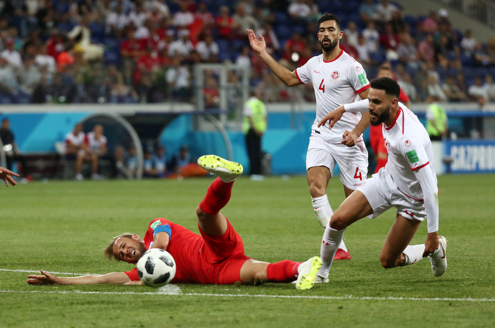 Englandu00e2u20acu2122s Harry Kane in action with Tunisiau00e2u20acu2122s Dylan Bronn and Yassine Meriah during the Group G match at the 2018 Fifa World Cup in Volgograd June 18, 2018. u00e2u20acu201d Reuters pic