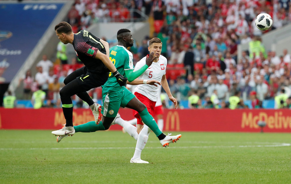 Polandu00e2u20acu2122s Wojciech Szczesny and Jan Bednarek in action with Senegalu00e2u20acu2122s Mu00e2u20acu2122Baye Niang during the Group H match in Moscow June 19, 2018. u00e2u20acu201d Reuters pic