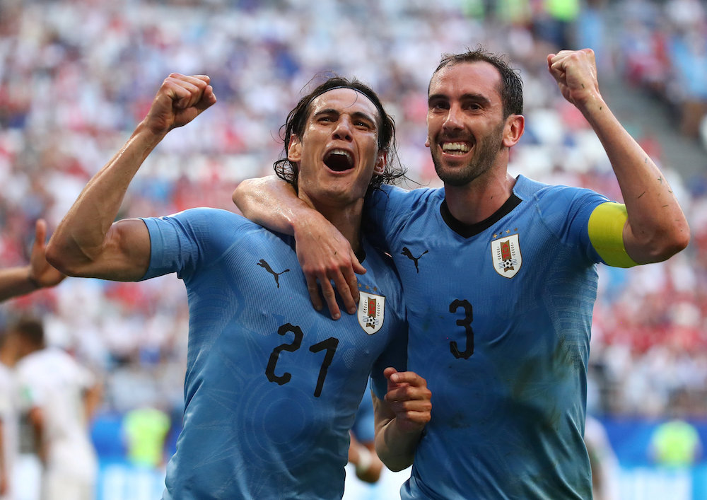 Uruguayu00e2u20acu2122s Edinson Cavani celebrates scoring their third goal with Diego Godin against Russia at the 2018 Fifa World Cup in Samara June 25, 2018. u00e2u20acu201d Reuters pic